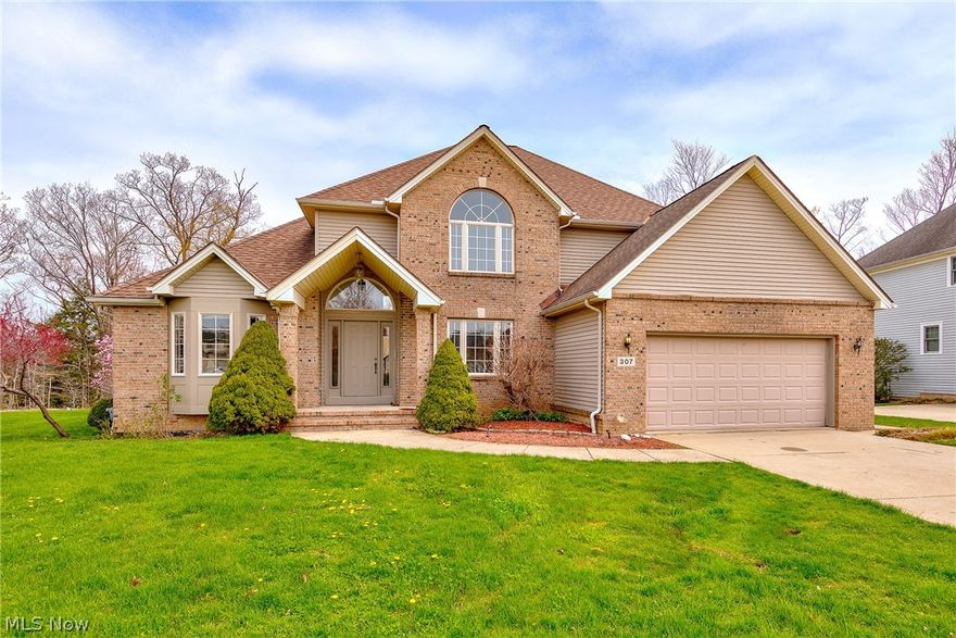 Beautiful Colonial with a contemporary feel and great curb appeal in Richmond Bluffs. 2 story foyer with marble flooring, dramatic 2 story great room with large picture windows overlooking the backyard which is a wooded sanctuary. Open concept great room/eat-in kitchen with see through fireplace ~ great for entertaining! Updated kitchen with granite counters, new appliances, backsplash, center island with cook top and sliders to the backyard patio. Formal dining room with marble flooring. Master suite on 1st w/beautifully updated bath w/two vessel sinks, separate shower and large corner spa, soaking tub. 1st floor laundry and powder room on 1st. floor features 2 bedrooms that share a full bath and a generous sized loft area that can be used as an office or den. Freshly painted and carpeted ~ move in ready. The lower level is unfinished and waiting for your specific design plans ~ would make a great multi-media space or several recreation areas. 2 car attached garage. Welcome Home!