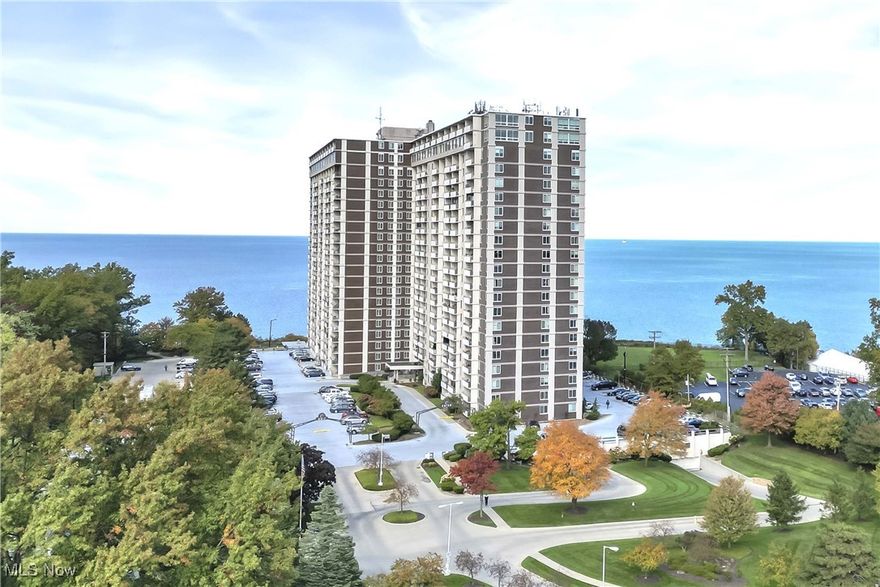 #1518 - Absolutely spectacular!  Shows like a model suite!  You will want the opportunity to own this one bedroom step down living room open concept floor plan in exciting Carlyle remodeled to perfection! Experience sweeping serene Lake Erie water views, the sounds of crashing waves, and stunning picturesque sunsets way over the tree tops from your inviting, private balcony. Luxury laminate flooring throughout all living spaces, freshly painted in today's colors with custom solar shades on all windows. The kitchen features modern custom cabinetry thoughtfully designed to maximize storage potential, along with quartz countertops, glass back splashes, sparkling stainless steel appliances, and under sink filtered drinking water.  The fully redesigned bathroom offers new chic cabinetry, lighting, and fixtures with a warm water bidet and a beautifully tiled walk in shower. The lovely cabinetry in living room and bedroom are not attached and are available for separate purchase. This suite is also equipped with new windows and patio doors part of a building wide project. One heated underground garage space and one storage locker is included.  Maintenance fees cover heat, air conditioning, water, sewer, gas for cooking.  Separately metered is electric (approximately $20.00 per month), cable and internet.  Corridor carpeting throughout the building is in the process of replacement. The Carlyle offers a full complement of amenities including 24/7 reception and security, on site management and in-suite maintenance, indoor and outdoor swimming pools, sauna, hot tub, fitness center, two party rooms, racquetball, laundry center, rental guest suite, two car wash bays, outdoor garden plots are available in the summer, Boardwalk Neighborhood Market, Summer Place Restaurant and more!