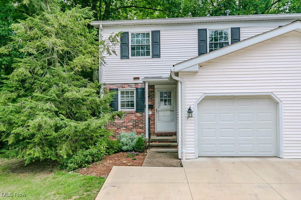 Rare Opportunity to Live in the Heart of Chagrin Falls Village! Just steps from shopping, dining, schools, and all that this charming town has to offer! This stunning end-unit townhome is fully updated and move-in ready. Enjoy the extra privacy of an end unit plus an extended driveway that allows parking for two cars side by side. Inside, you’ll immediately notice the freshly updated first floor featuring new luxury vinyl plank flooring, neutral paint, modern LED lighting, and a completely remodeled kitchen with white cabinetry, quartz countertops, tile backsplash, and stainless-steel appliances (all stay!). A built-in quartz dining island flows seamlessly into the Dining room overlooking the spacious living room, where a sliding door opens to your private patio and backyard. Also on the main level are a convenient laundry area (washer/dryer included) and an updated powder room. Upstairs, the oversized primary suite boasts original hardwood floors, three closets, and a private, fully updated en-suite bath with a beautiful tile shower. Two additional bedrooms and another remodeled full bath complete the second floor. The lower level offers a flexible rec room or plenty of storage space. Recent updates include: Full kitchen remodel (2023), Garage door (2023), Luxury vinyl plank flooring (2023), LED lighting (2023), Bathrooms (2023), Hot water tank (2021), Furnace (2019), Windows (2018).This townhome combines modern updates, classic charm, and a prime location in Chagrin Falls Village. Schedule your private showing today as this one won’t last long!