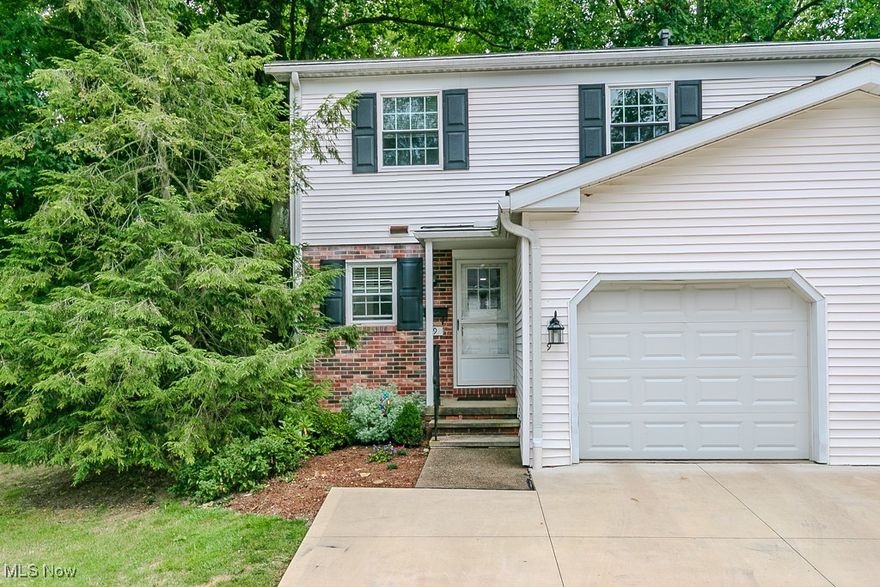 Rare Opportunity to Live in the Heart of Chagrin Falls Village! Just steps from shopping, dining, schools, and all that this charming town has to offer! This stunning end-unit townhome is fully updated and move-in ready. Enjoy the extra privacy of an end unit plus an extended driveway that allows parking for two cars side by side. Inside, you’ll immediately notice the freshly updated first floor featuring new luxury vinyl plank flooring, neutral paint, modern LED lighting, and a completely remodeled kitchen with white cabinetry, quartz countertops, tile backsplash, and stainless-steel appliances (all stay!). A built-in quartz dining island flows seamlessly into the Dining room overlooking the spacious living room, where a sliding door opens to your private patio and backyard. Also on the main level are a convenient laundry area (washer/dryer included) and an updated powder room. Upstairs, the oversized primary suite boasts original hardwood floors, three closets, and a private, fully updated en-suite bath with a beautiful tile shower. Two additional bedrooms and another remodeled full bath complete the second floor. The lower level offers a flexible rec room or plenty of storage space. Recent updates include: Full kitchen remodel (2023), Garage door (2023), Luxury vinyl plank flooring (2023), LED lighting (2023), Bathrooms (2023), Hot water tank (2021), Furnace (2019), Windows (2018).This townhome combines modern updates, classic charm, and a prime location in Chagrin Falls Village. Schedule your private showing today as this one won’t last long!