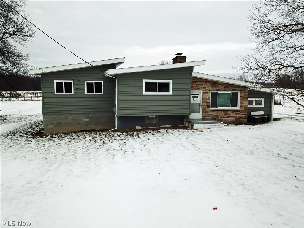 Once of a kind opportunity to own your dream! 15 acre turn-key Equestrian Farm located 10 minutes from West Branch rider trails! This one has it all and a new master bedroom addition with master bathroom and walk-in closet! You won't be parking anything outside with garage space for 6-8 cars! This property is set up with a 6 stall 48x48 barn with tack and feed rooms, concrete floors, automatic waterers and turn outs from the stalls. Eight beautiful wood fenced pastures, lighted indoor 60x120 riding arena (built in 2010), outdoor sand based riding arena, heavy use limestone pad and parking. Wooded back acreage to cut your own firewood with deer and wild turkey. Home has a cozy sunken family room and a living room with hardwood floors and a beautiful stone fireplace with a wood burning insert. Whether you want to run a successful boarding business or to give riding lessons this one is for you! Call today to schedule your showing! This won't last long!