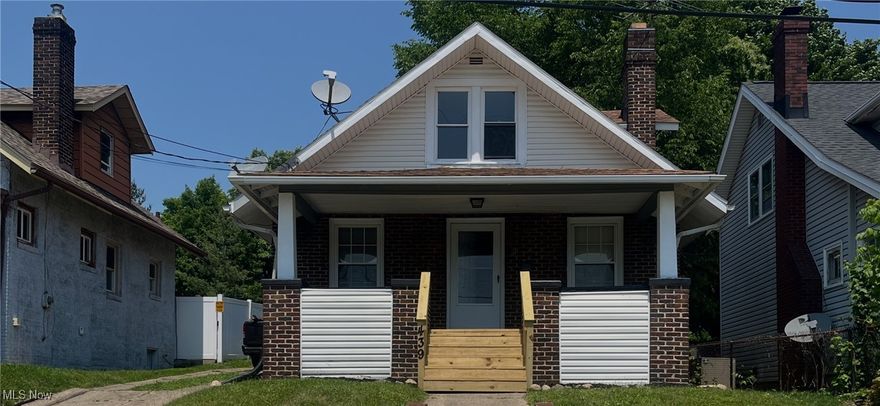 Welcome to this adorable, updated brick home.  This 2-bedroom with a fully covered front porch is sure to please on those warm summer evenings.  Step inside to discover the original hardwood floors in the spacious living and formal dining rooms, complemented by a full-wall fireplace and built-ins.  Upstairs, you'll find two generously sized bedrooms with new wall-to-wall carpet.  The full bath was recently updated with new LVP flooring, vanity, mirror, and freshly painted.  There is also a large 2-car garage with a newer garage door and opener.  Whether you're a first-time home buyer, downsizing, or looking for a turnkey investment property, this home is a perfect fit.  Great location!  Walking distance to Swensons, Dontino's, and the Gorge Metro Park.  Easy access to Rt. 8.  Set up your personal showing today!