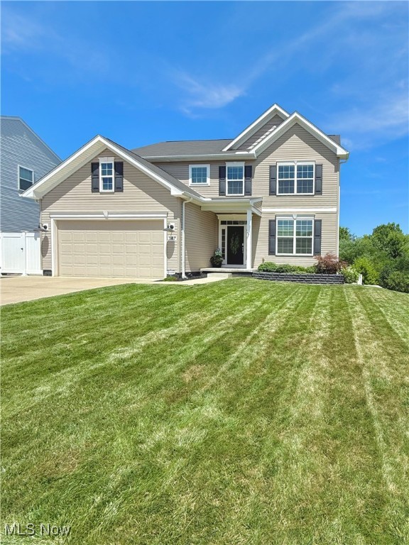 Step into luxury and comfort at 187 Oakview Circle, a modern colonial home built in 2016, nestled in the serene community of Woodridge Place in Tallmadge. This stunning property offers an open layout that fills the home with natural light and a lot of space for everyone. The main level offers a spacious first-floor primary suite, complete with a large walk-in closet and en-suite bath with a linen closet, a convenient and spacious first-floor laundry room and bonus room, for an additional bedroom or office. The kitchen is a chef's dream, featuring white ice-colored appliances, a large walk-in pantry, and tons of counter space, and large island with storage. The massive vaulted ceilings bring natural light in from every corner, highlighting the home, a large dining area, as well as the living room with a beautifully stoned floor to ceiling gas fireplace. Upstairs, you'll find two additional bedrooms, each with its own large walk-in closets, providing plenty of storage. As well as a spacious bathroom and loft/ seating area just calling you to kick back and relax. The finished walk-out basement offers endless possibilities, a bathroom area plumbed and ready to be installed for an additional bedroom and bath. Outdoors, enjoy the beautifully landscaped gardens and two-level decks with durable Trex rainscape drainage system to protect the lower deck from rain making it perfect for entertaining all year round. Along both sides of the home you will find concrete steps leading you to where your private backyard awaits. A 6-foot vinyl privacy fence encloses the backyard, ensuring peace and seclusion. The front and side of the home has a permanent irrigation system with smart technology that keeps the lawn green, lush and vibrant.The property backs up to a picturesque wooded area with a tranquil pond, offering stunning natural views year-round.A 2-car attached garage and thoughtfully designed outdoor space, this home is the perfect blend of modern living and natural beauty.