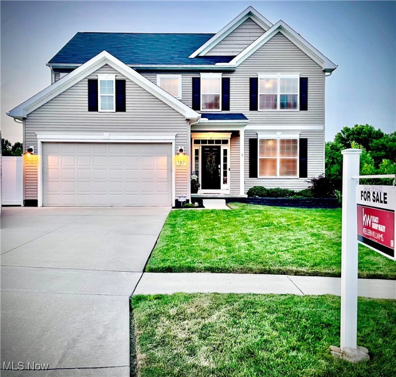 Step into luxury and comfort at 187 Oakview Circle, a modern colonial home built in 2016, nestled in the serene community of Woodridge Place in Tallmadge. This stunning property offers an open layout that fills the home with natural light and a lot of space for everyone. The main level offers a spacious first-floor primary suite, complete with a large walk-in closet and en-suite bath with a linen closet, a convenient and spacious first-floor laundry room and bonus room, for an additional bedroom or office. The kitchen is a chef's dream, featuring white ice-colored appliances, a large walk-in pantry, and tons of counter space, and large island with storage. The massive vaulted ceilings bring natural light in from every corner, highlighting the home, a large dining area, as well as the living room with a beautifully stoned floor to ceiling gas fireplace. Upstairs, you'll find two additional bedrooms, each with its own large walk-in closets, providing plenty of storage. As well as a spacious bathroom and loft/ seating area just calling you to kick back and relax. The finished walk-out basement offers endless possibilities, a bathroom area plumbed and ready to be installed for an additional bedroom and bath. Outdoors, enjoy the beautifully landscaped gardens and two-level decks with durable Trex rainscape drainage system to protect the lower deck from rain making it perfect for entertaining all year round. Along both sides of the home you will find concrete steps leading you to where your private backyard awaits. A 6-foot vinyl privacy fence encloses the backyard, ensuring peace and seclusion. The front and side of the home has a permanent irrigation system with smart technology that keeps the lawn green, lush and vibrant.The property backs up to a picturesque wooded area with a tranquil pond, offering stunning natural views year-round.A 2-car attached garage and thoughtfully designed outdoor space, this home is the perfect blend of modern living and natural beauty.