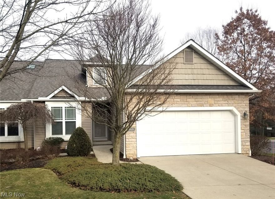 Original Model Home offers many extras and updates including custom window treatments. The home has been well maintained. The foyer entrance has a 2-story ceiling. Open floor plan features a Great Room with a corner fireplace, Dining Room area and Kitchen. The Kitchen has upgraded light colored cabinets with trim molding on top, higher-end countertop and wood floor. The Morning Room / Sun Room offers extra living area, has many windows and leads to a balcony. There are 2 bedrooms and 2 full bathrooms on the main floor. The main bedroom also has a large walk-in closet. Other features on the 1st floor include closets and a laundry room area. The lower lever (basement) has double Recreation Room areas. Ideal for a Home Theatre, Lounging area, Reading Room or Game Room area. A sliding glass door opens to a patio under the balcony.  There are double doors opening into the storage area of the basement which has roughed-in plumbing for a future bathroom.