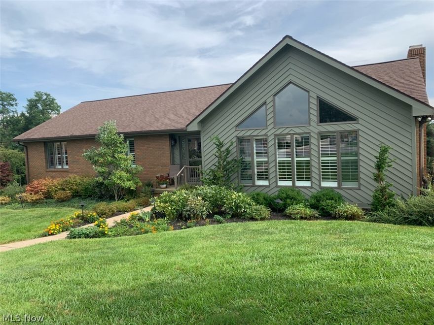 Total brick ranch with 3500 Sq. ft.of living space in pristine condition.  This home has cathedral ceilings, media room with beautiful views, large rec room with fireplace, professional landscaping and so much more. A must see.