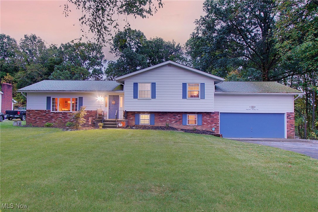 Welcome to this beautifully updated 4-level split home with over 2,000 sq ft of living space, featuring 4 bedrooms and 3 full bathrooms. The eat-in kitchen has been upgraded with granite countertops, under counter lighting, cabinetry, plenty of storage and appliances included. The dining area opens to a vaulted-ceiling living room—perfect for entertaining. The lower-level family room offers a cozy fireplace and a private bedroom with a full bath, ideal for guests or a separate living area. The partially finished basement provides a great space for entertaining, he/she cave, game room or other additional living space you need with extra storage and a dedicated laundry area. Upstairs, you’ll find three spacious bedrooms, including a primary suite with its own private bathroom and an additional full bath for the other bedrooms. Outside, enjoy the private backyard with a large patio, new vinyl chain link fence, and convenient access through two 5’ gates and one 10’ gate—ideal for bringing in equipment or recreational vehicles. A new 12x28 outbuilding adds valuable storage or workshop space. With a new septic system, new boiler, new outbuilding, new fence, fresh paint and trim, and thoughtful updates throughout, this move-in ready home is waiting for you to make it your own.