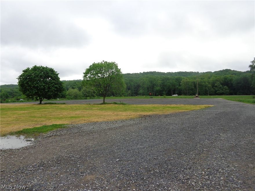 Unbelievable Interstate I 77 and CR 21 exposure!  3 1/2 acres of flat, build-able ground, no zoning.  Ideal for storage units, warehouse and office, gas and oil.  Great industry opportunity to build what you want, easy access with one well between New Phila and Stonecreek.
