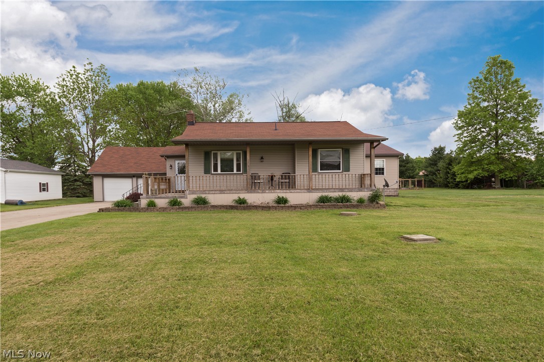 Peace and privacy await you at this lovely ranch-style home in Grafton! This home features an open floor plan, gleaming hardwood floors, a spacious backyard with a garden, and gorgeous updates throughout. The kitchen is beautifully remodeled and features custom cabinetry with under cabinet lighting and a full complement of stainless steel appliances. The great room boasts a cozy stone fireplace and provides deck access. The spacious sun room is located just off of the living room and also provides deck access. Three large bedrooms, including the lovely master bedroom, and two remodeled full baths complete the main level. The lower level includes a rec room and plenty of storage space. The great room, sunroom, and master suite are recent additions to the house, added within the last 15 years. Other recent updates include a newer roof, newer HVAC, and a newer sump pump. Outside, you are sure to enjoy sunny days relaxing on the back deck which overlooks the large backyard and lovely raise