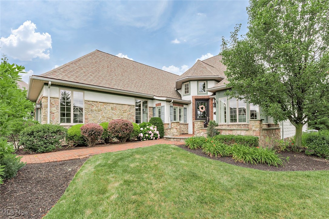 Welcome to this stunning, custom-built residence in the prestigious Sterling Lakes community of Pepper Pike. Designed for both luxury and comfort, this exquisite home offers a seamless open floor plan with wood floors throughout and elegant architectural details at every turn. A dramatic two-story living room w/ vaulted ceiling creates an impressive centerpiece, filling the home w/ natural light & grandeur. The formal dining room and a gorgeous home office provides sophisticated spaces for entertaining or working from home. The chef’s kitchen is the heart of the home, featuring high-end appliances, granite countertops, dual sinks, and an adjacent butler’s pantry. It opens to a warm and inviting hearth room with a fireplace—perfect for everyday living and gatherings. The main level features a spacious first-floor primary suite complete with a spa-inspired bathroom—steam shower with built-in TVs, jetted soaking tub, and expansive vanities. Upstairs, you’ll find two bedrooms and a loft area that provides a flexible space for a reading nook or study. The lower level is a true entertainer’s dream with a billiard room, two additional rec areas for privacy, a full second kitchen, full bath and abundant storage. Step outside to a beautifully designed deck that leads to a step-down patio—ideal for summer entertaining. Additional amenities include a heated garage and whole-house generator for added peace of mind. This home is the perfect blend of upscale finishes, thoughtful design, and timeless elegance—truly a rare opportunity in one of Pepper Pike’s most sought-after neighborhoods!