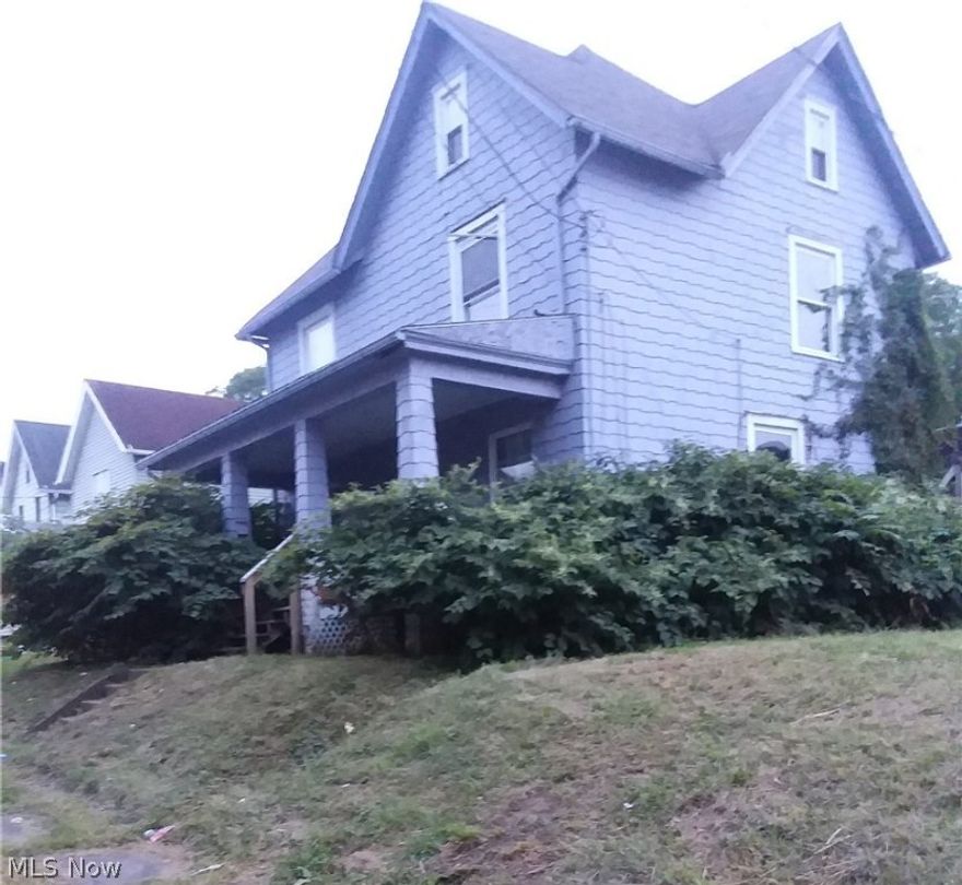 Large 3 bedroom two-story in need of some TLC. Newer windows. Convenient location.