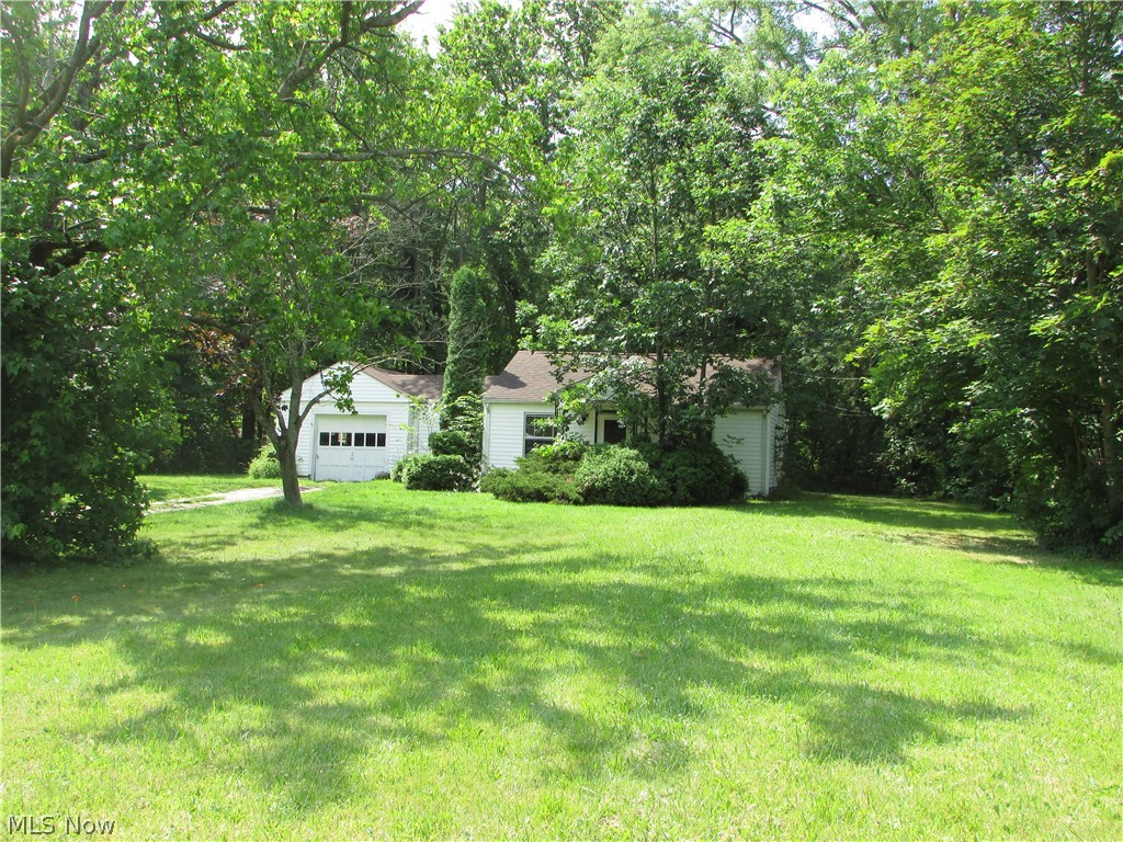 $20,000 PRICE REDUCTION!! 2.41 acres in Stow. This excellent deep, wooded lot is 126x863 with public utilities. The ranch home sitting on the property just needs a little TLC. It has a newer roof. Very nice outbuilding to the rear.