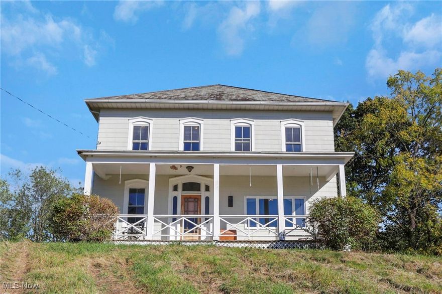 Charming 2-story farm/mid-century home on 20+ beautiful acres in Tri-Valley Schools! With 2,472 sq. ft., this 4-bed, 2-bath home blends timeless character with modern comfort. Features include high ceilings, original woodwork, decorative fireplace, living & dining rooms, laundry/mudroom, and office/flex space. The kitchen offers a walk-in pantry, reverse osmosis system, and smart double oven w/ air fryer (2023). Recent updates include whole-house humidifier & electrical (2023), well tank (2025), and AC blower motor (2025). Outside you'll find a 4-car garage w/ EV charger & workspace, 2 sheds, and a historic bank barn. About 17 acres are fenced w/ solar-powered fencing, perfect for livestock. A special added feature is a guesthouse w/ bath & kitchenette perfect for a home office, a comfortable guest stay or mother-in-law suite! ! The property is also equipped with a chicken coop w/ solar door, and cistern-fed water. Creek w/ a seasonal waterfall, small orchard, and hardwood trees complete this peaceful setting. Spring fed water and natural gas means no heat or water bills! Make this lovely homestead yours!