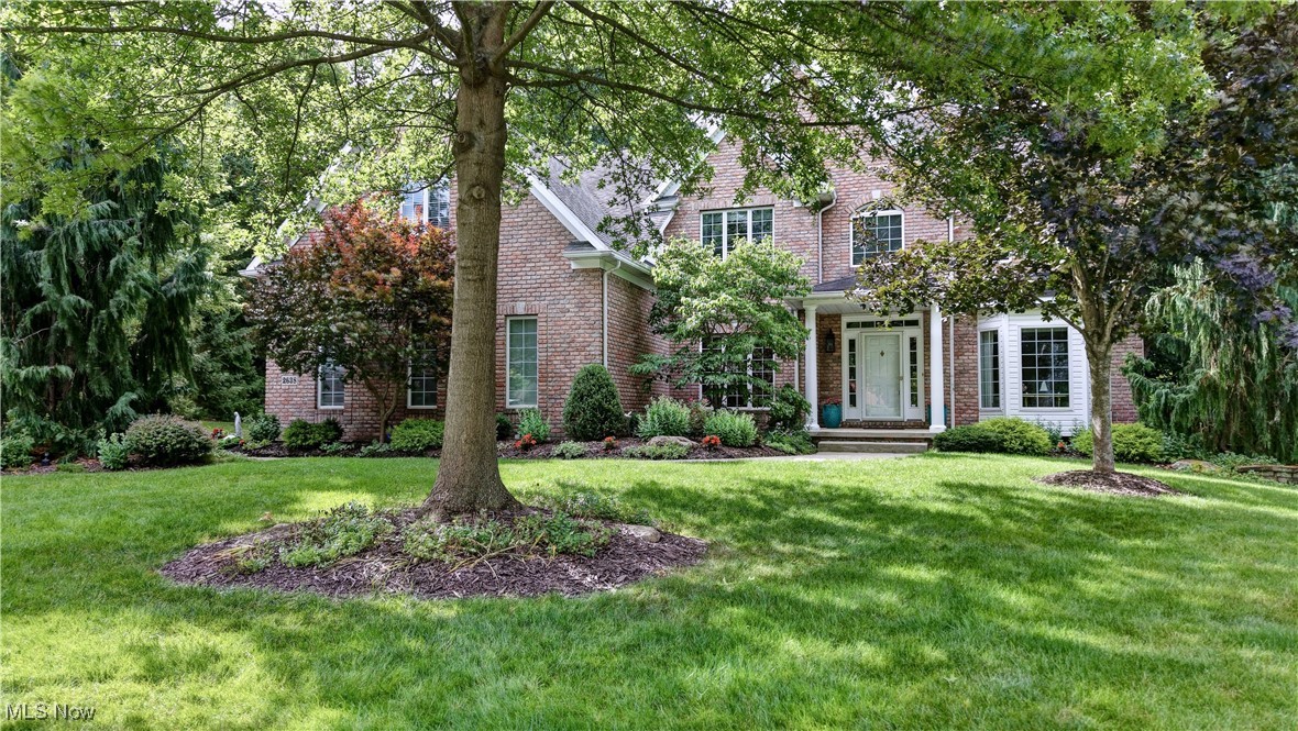 Beautiful Custom Built Brick Colonial Home located in one of Cuyahoga Falls finest West Hampton neighborhoods. This home offers over 3,500 sqft of living space on the first two floors with an additional finished 1,200 sqft of living space in the lower level that includes second kitchen, bedroom and full bath with a walk out lower level patio. You will love the open floor plan concept that includes a large open kitchen (Cherry Cabinets & Granite Countertops throughout) with backyard wooded views, and formal dining and living areas that are perfect for entertaining. The main living room has a beautiful two story stone fireplace and floor to ceiling windows that let in an abundance of natural light and over looks the wooded backyard along with a second stairway to the upstairs. The second floor has a beautiful private Master Suite w/Glamour Bath and large his/her walk in closets. The other three upstairs bedrooms are large w/ample closest space, two bedrooms share a Jack/Jill bathroom and the other has a full bath attached. The heated sunroom off the kitchen offers French doors w/vaulted ceiling and floor to ceiling windows so you can enjoy year round. Home has additional storage areas in the lower level and additional stairway exit to the 3 car attached garage. You will absolutely love this floorplan! This one wont last long, schedule your showing today!