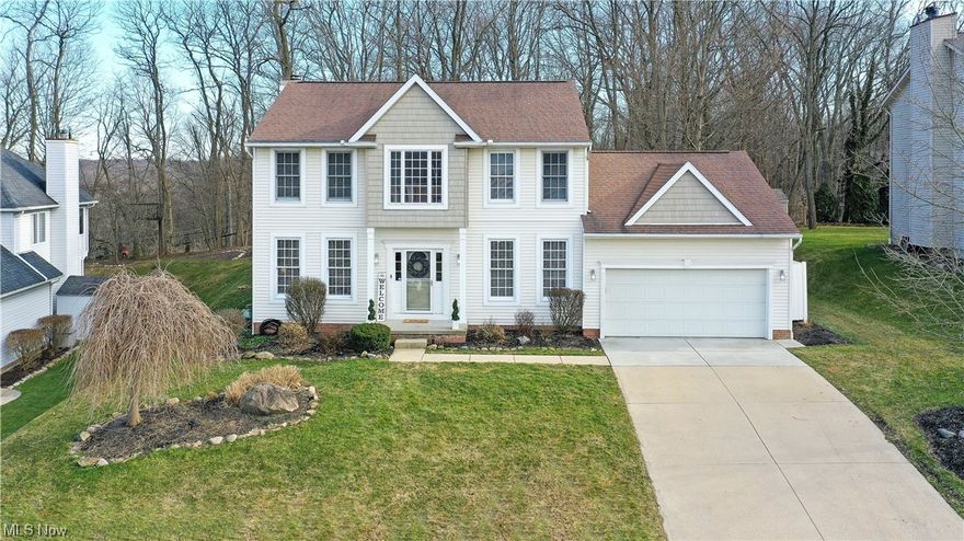 Gorgeous, quality-crafted Colonial, custom-designed and built upon a peaceful, parklike setting. Beautifully maintained and updated by original owners. Timeless crown molding, French doors, and columns throughout home. Recent updates include newer Kitchen, Primary Bathroom, Upstairs Hall Bath, Home Office, and much more! Sunny Morning Room, giant Mudroom, and approx. 10 x 10 Garage Extension with exterior entrance for organized storage. Three-tier deck with gazebo and backyard fire pit create great outdoor living space for family and friends. Built-in audio system and 9 ft. ceilings throughout main level. Entire first floor is hard surface – hardwood and tile – except Home Office. This property has Akron taxes and utilities, but is located within the Woodridge Local School District and has a Cuyahoga Falls mailing address. Home warranty included. Schedule your private showing today!