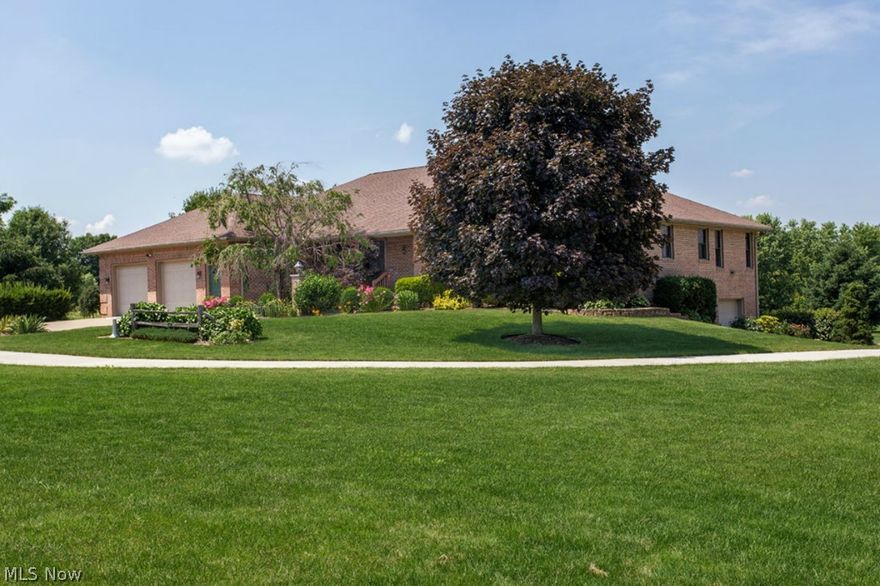 Custom Built * Open Floor Plan * All Brick Ranch * Meticulously Kept! First Floor In-Law Suite w/Full Kitchen! Sits 500 Ft Off Road w/Full Concrete Driveway! Over Five and a Half Acres! 22x6 Covered Porch opens to Wide Foyer Entrance w/Den to Open Center Island w/Breakfast Bar & Eat-In Kitchen w/Two  Skylights! Cherry Cabinets, SolidMaple Floors and Even Wide Maple Woodwork! Kitchen has Double Sided Brick Hearth Wood Burning Fireplace Shared with Spacious Family Room w/Nine Foot Ceiling! 3200 Square Feet Upstairs and a Full Unfinished Walkout Basement (with a Full Bath)! Covered 12x12 Deck off Kitchen! Master Bedroom with Full Bath plus 2 Additional Bedrooms and Main Bath on One Side of House and the In-Law Suite with Living Room/Kitchen Spacious Bedroom and Oversized Full Bath is Handicap/Wheelchair Accessible w/Wider Doorways and Hallways. It Also has it's own 14x10 Deck!  Newer (2013) 96% Hi-Efficient Gas Furnace w/ Dual Controls for Heat and A/C! Also Newer (2011) 75 Gal Hot Water