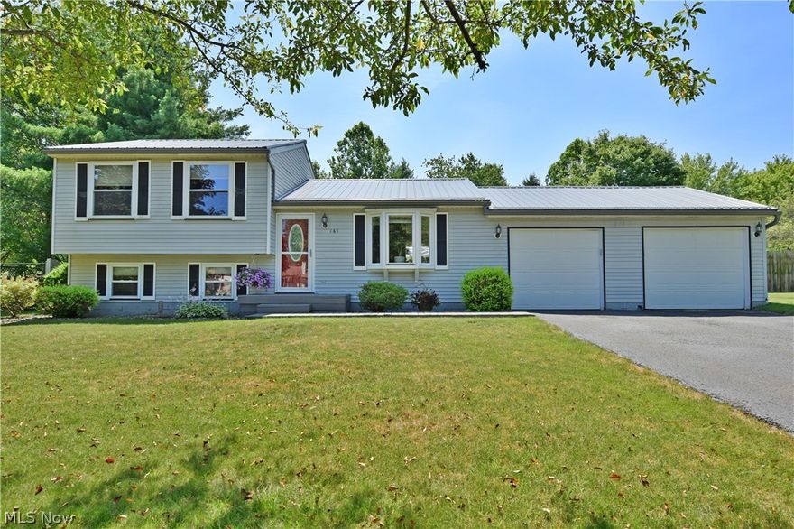 Packed with features and comfort alike, this fantastic Champion two-bedroom home is one you won’t want to miss! Take in the sights both inside and out as tons of curb appeal is found with the unique steel roof, a four-car garage with pass through bay, and a masterful, fenced in back yard with an absolutely stunning rear patio area. Other highlights include a large shed found in the corner of the sizeable yard. Through the front door, a lavish living room explodes in natural light from the prominent bay window. The carpeted living space bridges the main stairwell and the expansive kitchen alike. Here, casual eat-in dining offers scenic views while an array of natural wood cabinetry warps the kitchen. Stone styled countertops pair perfectly with the tiled backsplash. Downstairs enjoy a taste of Italy with faux brickwork and colorful ceiling treatment that paints a relaxing environment. Around the corner, a bonus room is setup as a salon while a half bath joins lower laundry. Upstairs, tw