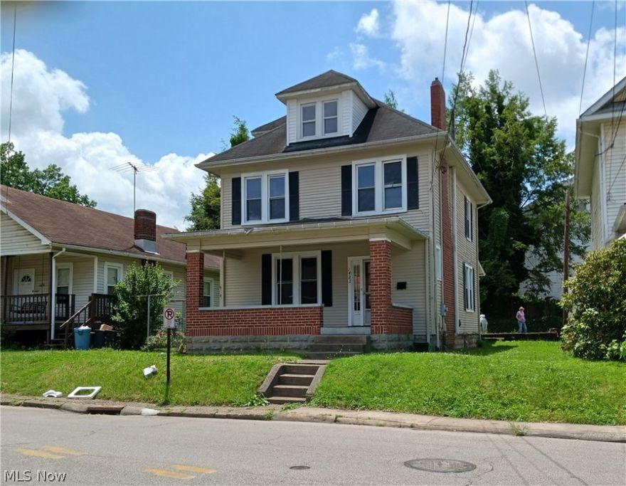 Great investment, this home has a lot of potential. Built-ins in the living room, French doors leading to the upstairs. Still has original woodwork. Third floor is finished. Large, covered deck out back off of kitchen. Parking area outback off of alley. Newer windows, heat approximately 5 years old "per seller"