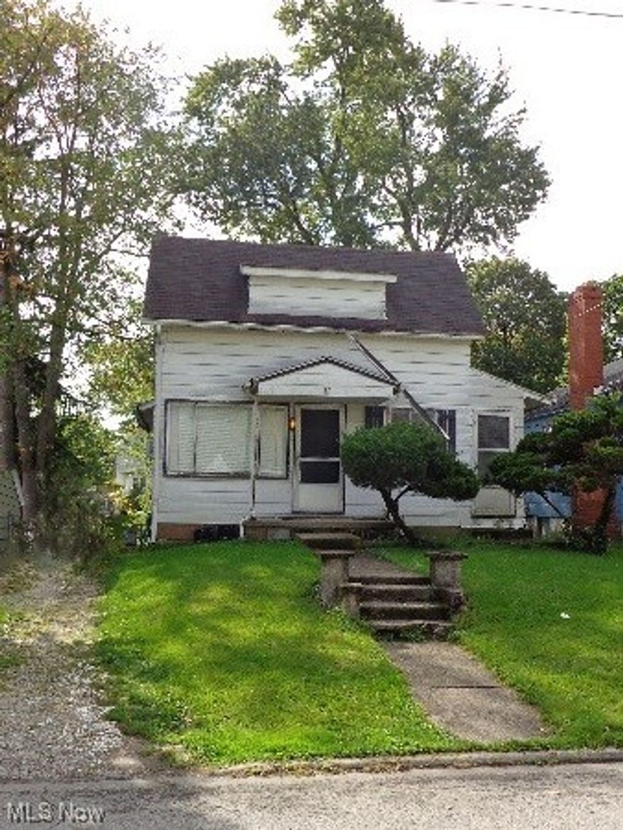 Wonderful opportunity to live on a quiet street. This 2 bedroom, 1 bath home has a full basement with garage door access in the back.  There is a gravel drive and covered entry, and a lovely treed back yard.