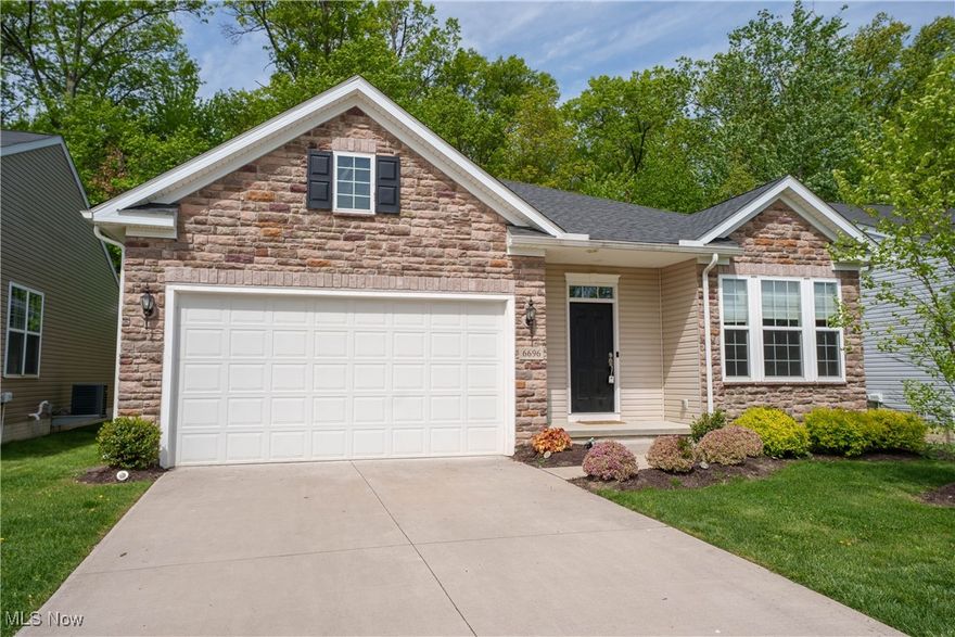 Welcome to 6696 Amber Way in North Ridgeville, Ohio! This stunning ranch-style home was built in 2020 and offers 2 spacious bedrooms, a dedicated home office (easily a 3rd bedroom), and 2 full bathrooms — all on one level for effortless living. Tucked into the desirable Lifestyle Section of Meadow Lakes, this home backs directly to Sandy Ridge Metro Park, offering wooded views, and ultimate privacy. Inside, enjoy an open-concept layout with vaulted ceilings in the Great Room and stunning Kitchen, a cozy stone fireplace, and a chef’s kitchen with stainless appliances, large island, with lots of cabinet space and additional bar seating. The Owner’s Suite features a walk-in closet and a private on-suite bath. Additional highlights include a large laundry room/ Mudroom with Laundry Tub and premium finishes throughout. Community Perks: Enjoy miles of scenic walking trails, fountains, and private ponds exclusive to residents — perfect for fishing, picnics, or peaceful strolls. Low-maintenance living at its best — schedule your tour today!