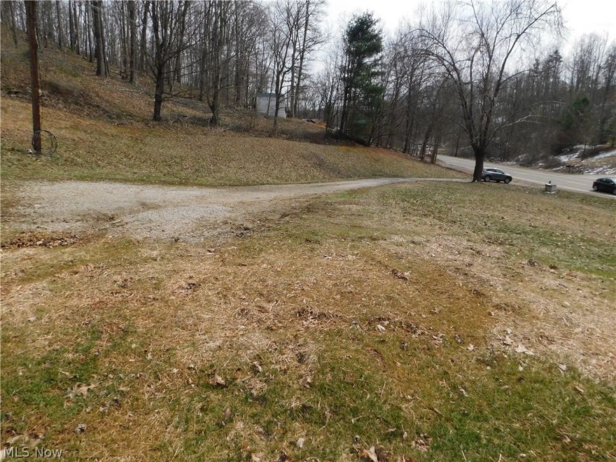 Lot just past WVUP on RT 47 at Meadville Road. Home was once there but has been destroyed.