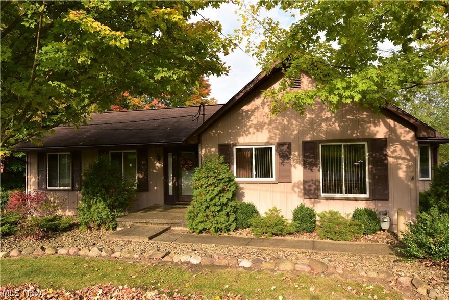 Take time to enjoy the small things in life & relax w/your precious family! This home & it's 9+ acres offer solitude & opportunities to have fun like we used to "back in the day". Relax on your front porch & watch the adorable alpacas across the street, take a stroll down your quiet country road & listen to chirping birds & various wildlife, ride 4 wheelers on your vast property, take your son hunting out back, or wait until nightfall to go out & sip on some hot cider, warm your toes at your cozy firepit on the paved patio area tucked away on the side of the home. Ever wanted to raise your own chickens or goats? Well, there's a single stall barn ready & waiting for some sweet animals. What else can you do with all that land? Plant a colossal garden! This 3 bdrm, 2 bath home has been loved & lived in by the same family for the past 50+ years. It has over 2260 sq ft of finished living space. There's a tandem garage & work space on right side & a second garage w/single space parking & uti