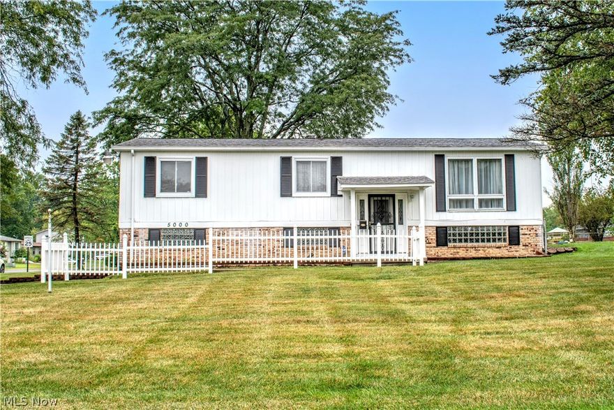 Welcome to 5000  Fifth ave. This home has tons of potential with a little facelift. This 3 possible 4 bedroom home has been well maintained over the years. Kitchen has beautiful cabinets that give plenty of storage and all appliances stay included the newer stainless Kenmore Elite refrigerator. Off  the kitchen there is a door leading to your covered back porch to enjoy those warm evenings or  your morning cup of joe. Three  bedrooms  and full bath on the main floor and large room on lower that could be used as rec room, den, or even a 4th bedroom. Lower floor also has its own full bath that also holds your laundry area with washer and dryer that also stay.  Built in garage has newer garage doors and additional storage. Roof is newer and has leaf filter installed. But the big show stopper on this home is the Huge detached 2 car garage perfect for restoring, storing or to fill the need for any hobbies you may have. It has its own electric and tons of storage space. Some newer windows th