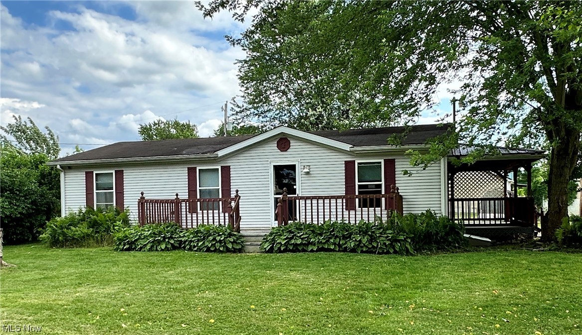This 1998 mobile home is a well-maintained property with a single owner, offering comfortable living in a convenient location. Situated on a corner lot that consists of 3 parcels that is flat and level making it easy to navigate and maintain. The home features three bedrooms and two bathrooms. Upon entering the home, you are greeted by a covered deck that leads to a spacious kitchen. Upon entering the home from the front door, a front deck takes you into a spacious living room. This living room offers a welcoming and comfortable space to relax and spend time with family or guests. The property includes two sheds and a big outbuilding, providing additional storage space for tools, equipment, or other belongings. A gazebo with a picnic table is situated on a deck, offering a dedicated area for outdoor entertaining. This space is perfect for hosting gatherings or enjoying meals in the open air. In terms of location, the mobile home is conveniently close to the interstate. Additionally, n
