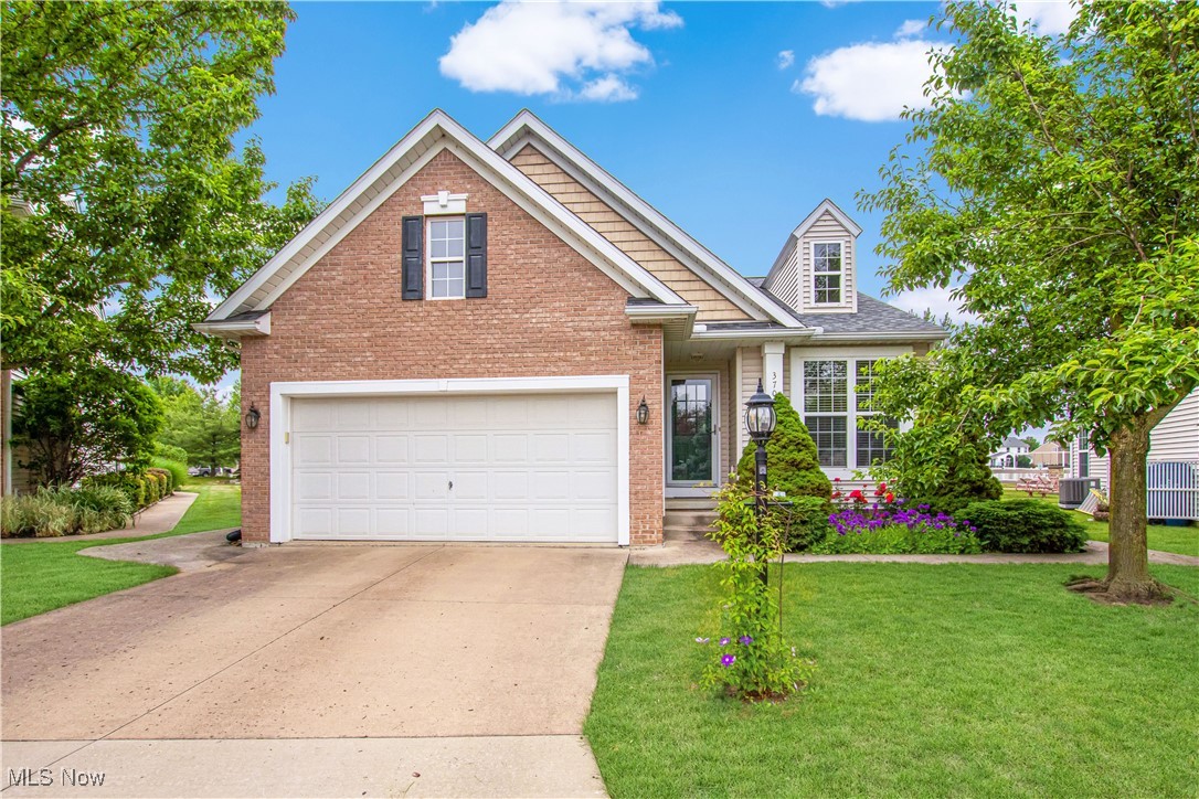 There's a lot to be excited about at 37058 Danforth! Located in the Stonegate at Waterbury subdivision on a tucked-away cul-de-sac, you'll feel right at home in this cozy two bedroom ranch that boasts a tear-off roof just installed in 2023! With a clean-looking combination brick/vinyl exterior, the home opens up to a spacious great room as you walk through the front door. With a vaulted ceiling and plenty of space, you'll be able to configure furniture and host guests as you see fit! There is also a home office adjacent to the main entrance too for the ultimate work-from-home capability. The carpet in the home has just recently been stretched and cleaned and will feel like new! The open and bright kitchen will be your next stop on the tour, with plenty of room for an eat-in table. Be sure to note that all appliances are included as well! Beyond the kitchen is a phenomenal three-season room - perfect for Summer! This 16x13 space comes with an included entertainment center and cabinets and is a great place to relax and take in a nice breeze! Heading back inside and down the hall you'll encounter the guest bath, which is the first of two full baths in the home! Visit next the master bedroom featuring a walk-in closet and ensuite too! A guest bedroom and the laundry area (complete with washer and dryer) round out the first floor. And yes, this home does include a basement! This lower-level space can be used for storage, or finished for additional room to enjoy. The Waterbury community features a clubhouse, a playground, and a pool, and the Stonegate association allows owners to decide if they'd like landscaping and snow removal taken care of for them. This could be the low-maintenance ranch you've been waiting for, so schedule your tour today!