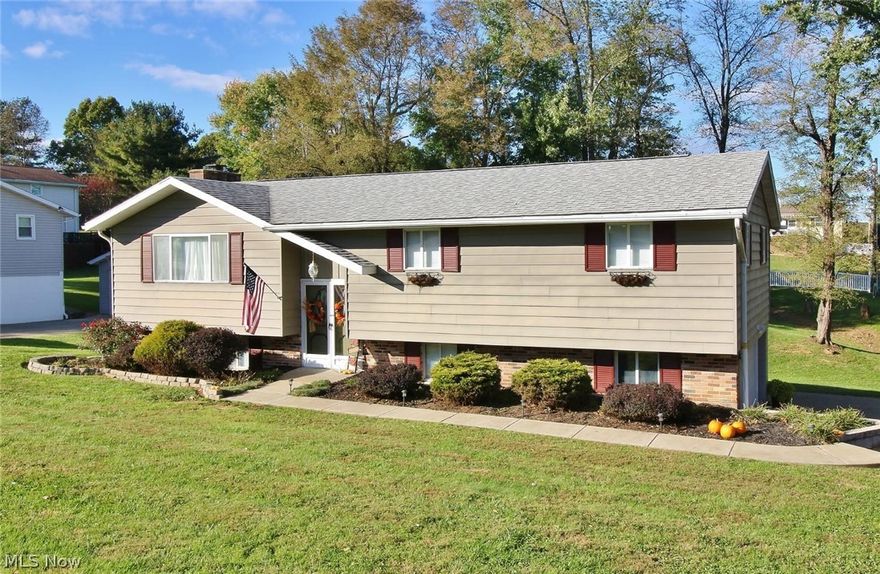 This split level home that sits on a large lot , has a nice living room that flows into the kitchen and dinning room , the french doors out to the large private deck. Three bedrooms and 2 and 1/2 baths , the lower level has a large family room with wood burning fireplace and a 2 car garage, all newer paint and carpet