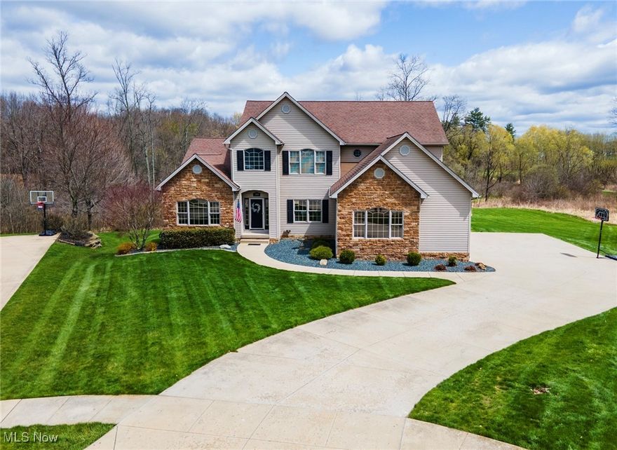 Stately Elegance is what you will find in this 5 Bedroom, 3 1/2 bath home! From the moment you enter you will be struck by the timeless design of 240 Aberdeen Court. A wall of windows and soaring stone fireplaces draw you into the heart of the first floor. Featuring a Gourmet Kitchen, Gathering Room, Great Room, Dining Area, Powder Room, Office and Master Suite. On the 2nd floor you will find an open Loft overlooking the amazing Great Room, 3 additional bedrooms and a full bath. On the lower level you are greeted by a lovely view of the back yard, a Bar complete with Kitchen, Family Room, Play Room (5th Bedroom), warmth from a coal burning burning pellet stove and access to the patio. The maintenance free deck offers a perfect entertaining area and overlooks the private view of the back yard. Completing this beautiful home is a 3 car garage with extra storage area. Come find all that Firestone Farms living has to offer with the luxury you deserve.