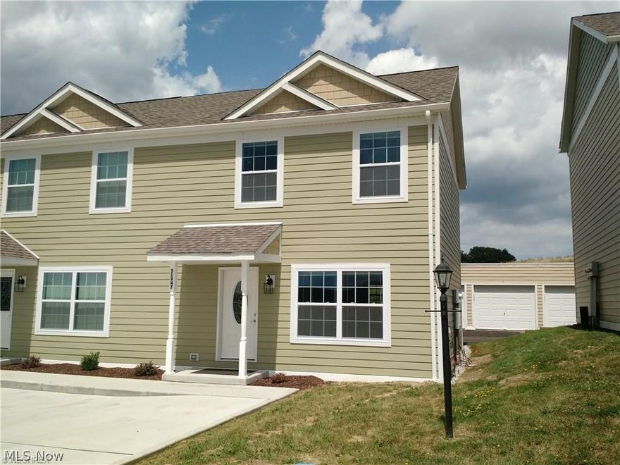 COMFORT & CONVENIENCE!! Enter through the covered entrance to this gorgeous 2015 END UNIT condo to feel right at home! BRIGHT & CHEERY, this 2 story, 2 bed (walk-in master closet), 2.5 bath unit to "call your own" has comfortable rooms with lots of natural sunlight pouring through the large windows!  The Eat In kitchen has beautiful cabinets, plenty of counter space and includes the refrigerator, range and dishwasher! The open floor plan allows for easy entertaining. This home is cable ready, has wood/carpet flooring, 1 car detached garage and a paved drive way! ALL SO CLOSE, within minutes, to I-70 & I-470; the Ohio Valley Mall, restaurants and theaters!! WELCOME HOME!!