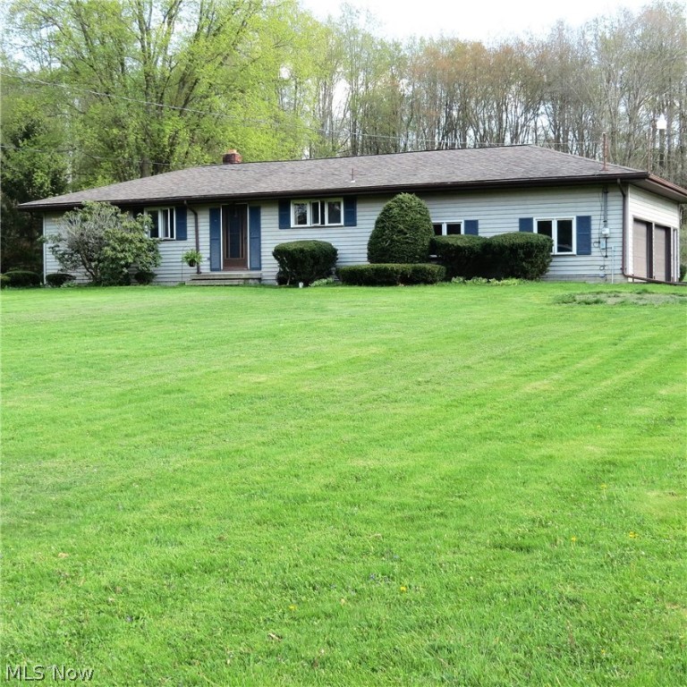 Looking for quiet country living??? Don't miss this great 3 bedroom, 2 bath ranch with 4 car garage (2 attached, heated, 2 detached). Situated on 2.83 peaceful acres with room for lots of outdoor activities, gardening, or a realxing walk through the woods. This home has been beautifully updated in neutral decor. Lovely, light living room features a vaulted ceiling and French doors that exit to the large enclosed patio where you can watch nature play in the expansive backyard & woods. Eat-in kitchen has plenty of wood cabinetry, large pantry & all appliances. Bedrooms have nice hardwood floors & good closet space. Main bath has been renovated. Second full bath & huge recreation room on the lower level is perfect for those indoor parties, could be used as a playroom, teen suite, hobby room, "man cave" or whatever your mind can create. The basement has been waterproofed and has stairs that also exit to the attached garage. Additional updates include newer water heater, sump pump, well ho