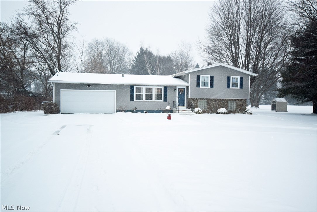 Must see this move in ready and updates 3 bedroom, 2 bath home on over 2 acres! Gorgeous Stone Fireplace in the family room! Beautiful oak kitchen a true must see! Master bedroom with a separate doorway to the shared full bathroom. Updated laundry room and 2nd full bathroom on the lower level Private spacious backyard, 24x20 outbuilding/3rd garage. Lots of updates! Newer Gas Furnace & A/C, Newer vinyl windows, Garage door(2005), New Roof(2008), Water softener system(2009), & Reverse Osmosis System(2005). Call today to schedule your showing!