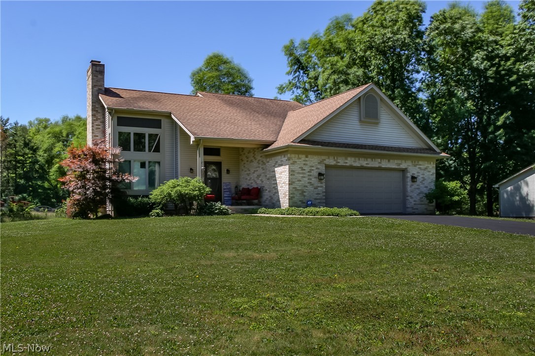 Updated throughout and move-in ready, this 4-bedroom, 3-full-bath home is a GREAT find! Howland Township & schools w/ Warren mailing address. Over 2,200 square feet of finished living space provides room for everyone! First-floor master suite w/ full bath and walk-in closet. Beautiful updated kitchen w/ center bar-island, SS appliances, and garden window overlooking the back yard walks out to the back deck which has wrap around bench seating. Two-story great room w/ loads of natural light, custom blinds, and serviced/functional gas fireplace. Dining room. First-floor laundry! Finished basement w/ rec. room, 2nd laundry room, storage, and a spacious 4th bedroom w/ new full bathroom! Two bedrooms and an updated bath on the second-floor w/ walk-in closet in the hall. Two-car wide paved drive with a true oversized 2 car heated garage w/ hot/cold water, and walk out door. Covered front porch. Public water/sewer. HWT/AC/Furnace under 5 years old. Roof under 10. Schedule your private viewing