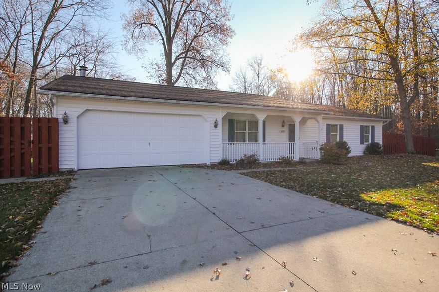 HOME SWEET HOME is this adorable, picture-perfect Ranch home tucked away next to the Sheffield Lake Reservation and only minutes from the Lake. Greeting you into the home is a vaulted entryway and gleaming Pergo flooring.  The room to the left as you enter is a great space to make your own!  Do you need an office or space for homeschooling? Maybe a place to craft, read, relax, or play games. Enter into the Chef's delight open concept eat-in kitchen also with vaulted ceiling and featuring Thomasville Hickory Shaker Style cabinets with drawer pullouts, under-mount cabinet lighting, and overhead recessed lighting.  The Granite countertops and extra deep sink with Stainless Appliances make this kitchen a delight for cooking.  Relax after dinner in the Great Room with your favorite show or it's that time of the year where we all want to have a cozy fire going.  Enjoy the wood deck and large private and fenced backyard with a compost area and shed ready for the gardener in you!  This yard is