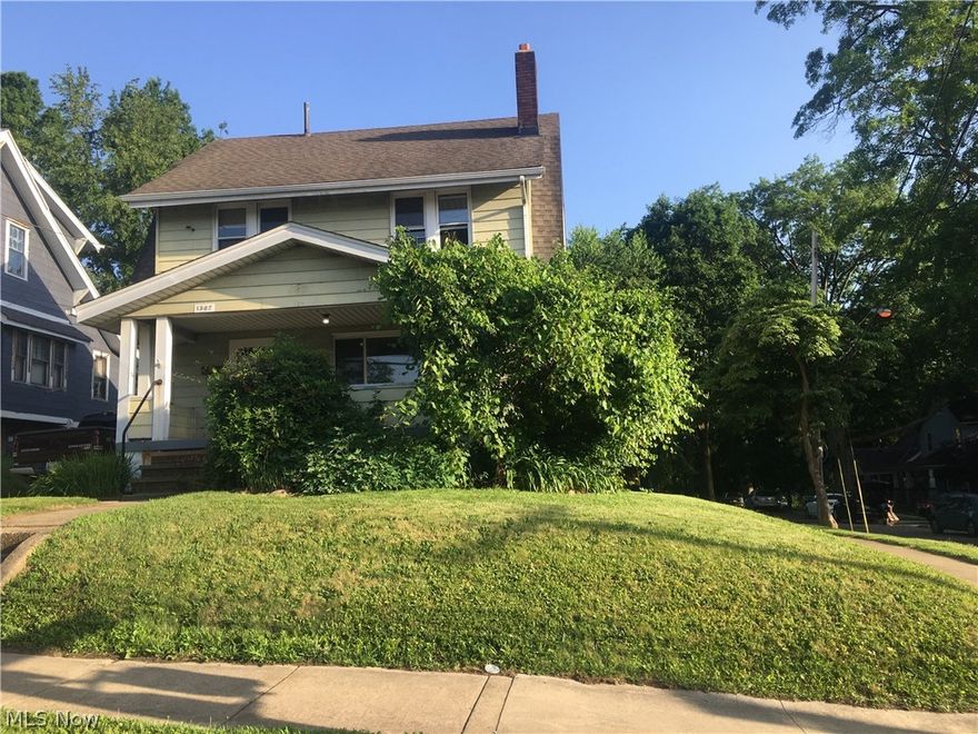 Three bedroom and two full baths and a bonus room on third floor. Walk into a covered porch Location across from school, close to expressway, retail and restaurants.  Walk into the home after the covered porch, into a nice size living room with fake brick fireplace and built in decorative cabinets. Large dining room with a full size bathroom off the back , adjacent to the full size eat in kitchen. Kitchen comes with stove, refrigerator, and built in table with benches. There is a mudroom off the kitchen which has door to backyard, two car detached garage, and paved driveway. Three bedrooms on the second floor , freshly painted, full size bathroom and built in linen closet in hallway. Third floor finished area separated in two areas. Home has central air, full size unfinished basement, newer windows. This home will feel like a home! Professionally managed. All interested applicants to apply online with a $50 application fee per adult.