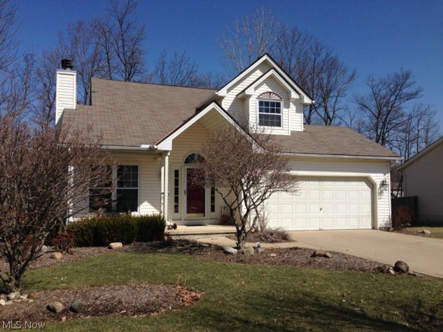 Welcome to this gorgeous, updated 3 bedroom colonial in Liberty Woods! This home offers a two-story great room with a wood burning fireplace, updated kitchen, open floor plan, beautiful oak hardwood floors, new carpet and tile (Mar '14), and new replacement windows (Jan '14). The finished basement has an oak custom-built wet bar, a gas fireplace, and plenty of storage. Upper and lower back decks provide lots of room for entertaining and a view of the large wooded backyard. The first floor laundry and large pantry offer convenience, and you'll love the spacious master suite. Shows beautifully!