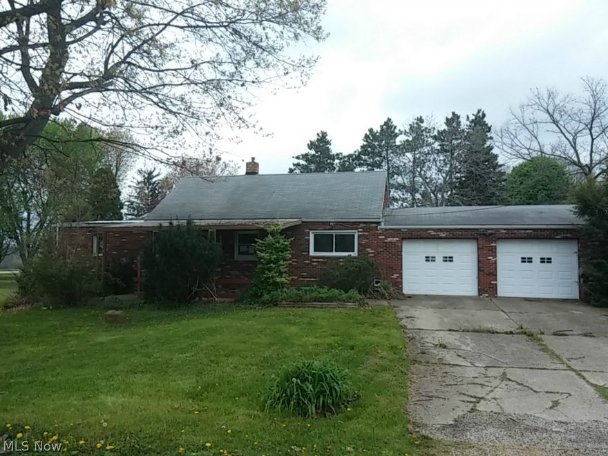 This country home needs some love and TLC but could be absolutely beautiful.  Set on a nice sized lot with bright, spacious rooms and a HUGE garage.  The setting alone will draw you to this home.  Come out and see it today!