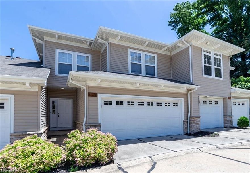 Highly desirable StoneRidge Townhomes. Beautiful three bedroom townhouse, with two story great room. Open floor plan with many updates including hardwood floors! Custom kitchen with cherry cabinets and stainless steel appliances overlooking the dining area with sliding glass doors to deck. Great room has two story picture windows which let in a lot of sunlight! Cozy gas fireplace to cuddle up next to when winter comes! Second floor has 3 bedrooms and 2 full baths. Large master suite has large garden tub, separate shower, and walk in closet. Full basement completely finished with built in bar. First floor laundry room! Private deck! Attached 2 car garage. Plenty of storage. New Range/Oven, Microwave, Dishwasher, & Disposal. Freshly Painted Interior! Extremely well maintained. Quiet neighborhood, Excellent Location! Shopping and restaurants nearby! Minutes away from I-480, I-77, OH-176... 15 min drive downtown. Easy maintenance free living!