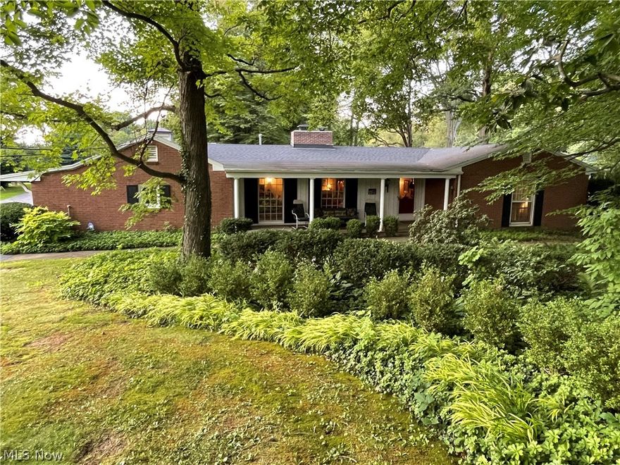Incredibly Charming 2195 Sf Brick Ranch on tranquil 1.32 acre park like setting equipped with a small 21x15 cottage set in the woods behind the home. If your looking to step in the past this is an absolutely perfect home from 1957 and it’s in mint like-new condition showing it’s pride of ownership. As you enter through the red Dutch front door into the foyer with slate flooring you are welcomed by a huge Living room with WBFP and leads to the formal Dining room appointed with a pass through window to the kitchen and saloon doors that lead to the warm and inviting Family Room with 2nd brick WBFP and wood paneled walls. Kitchen offers original Knotty pine cabinetry, built in wall oven and custom brick archway over the built in countertop grill. Laundry Rm/Mud rm with loads of built in storage & Pantry closet. Dinette area off the Family room walks out to a covered concrete patio and a large Brick terrace. 3 spacious bedrooms all have an abundance of closet space and one with a built in v