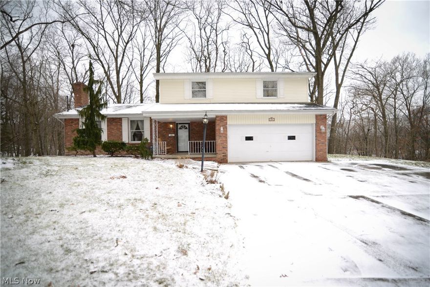 Your private sanctuary is Sitting on a cul de sac and offers a parklike setting 365 Days a Year! If you are looking for a large home with plenty of room to spread out make sure to come and view this one! Nice double drive widens to a triple and leads to an attached two car garage. Covered front porch. Nice large foyer opens to the living room with gas converted fireplace and hardwood floors then to the formal dining room! The equipped kitchen is loaded with cabinets and counter space, has a built in desk, pantry, and a breakfast bar that can accommodate stools all the way around. Oversized family room has beautiful wooden French Doors that lead out to a 3 seasons 20 x 10 sun room. The sun room itself has sliding glass doors all the way around! Come on out to your wrap around deck overlooking a wooded ravine. Excellent bonus room off the family room for an array of uses! The upper level of this home has 4 spacious bedrooms, great closet space and full guest bath. The Master bedroom offe