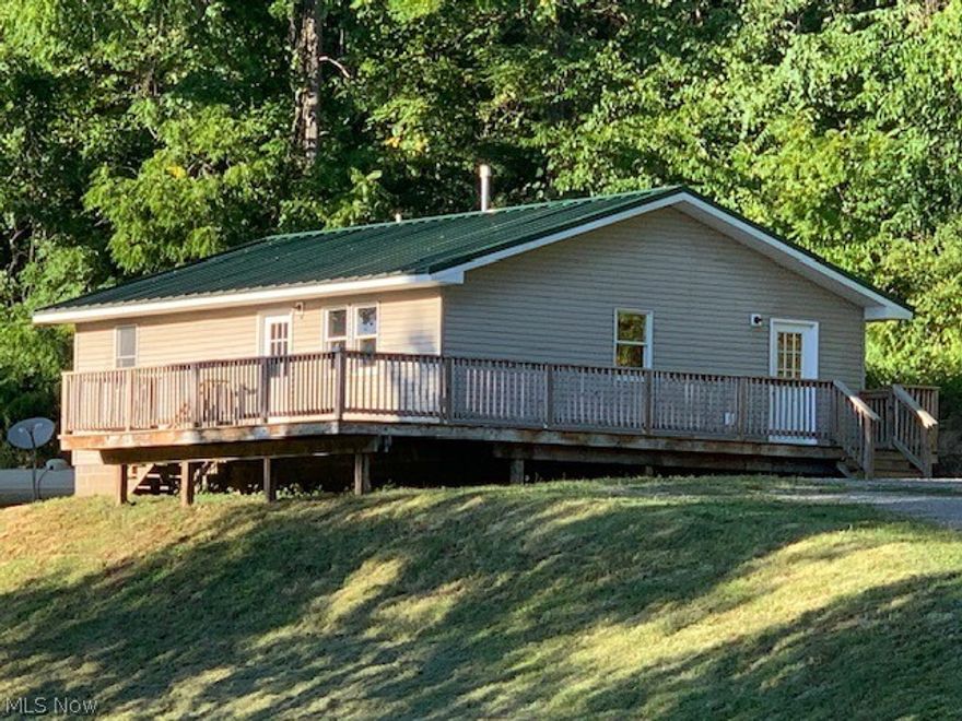 If you crave the outdoors, love sunsets and nature then this may be your new home! Built in 2016, this lovely ranch sits perched on top of a 2.06 acre stunning lot. This lot is huge, has many level areas, and can easily host the large garage you've always wanted to build. You'll love the wrap around deck and just the right amount of trees that make you feel as if you're tucked away in the forest. Recently painted in a neutral cream palate and sanitized, this home is ready for immediate occupancy. Want more yard space? Several surrounding building lots are also for sale. Here's the bonus- this home is located across the street from a fish hatchery and within walking distance to the entrance of the 1365 acre Zion Retreat & RV Park! -This is the lifestyle you've been wanting! 
Located in Harrison Hills School district, but Union Local Bus has picked up students at the entrance of Zion in the past.