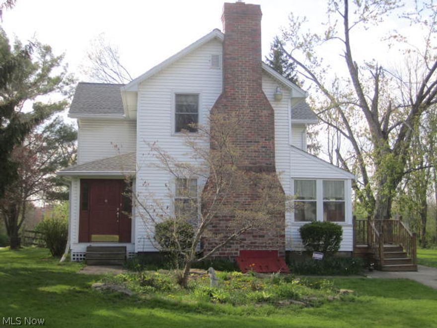 You will love this rustic home sitting pretty on 1.25 acres in the Canfield school district. This home offers Remodeled cherry kitchen with rustic ceiling beams and all appliances to stay for buyer's convenience, beautiful living room with fireplace with insert, exposed beams in both the living room and the dining room. The dining room is spacious with french doors that lead out to a large wooden deck. The home has 2 generous size bedrooms with walk in closets, a beautiful updated bath with oak crown molding and trim and a Jacuzzi, plus linen closet and another large walk in closet for other items. The home also offers a room for an office and a sun room. We have a 2.5 detached garage with a new roof in 2014,  Home has many updates, the roof on home is new in 2014,  the driveway is all concrete, also has newer kguard gutters and spouting, furnace and central air are less than 4 yrs. old, 200 amp electrical service, new hot water tank, chlorinated water system and  newer windows. Truly