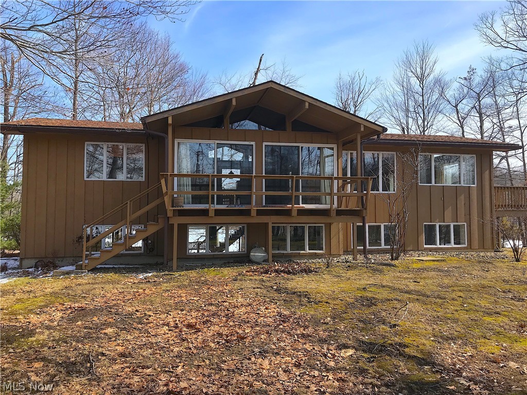 Stop searching now and book a showing because you have found one of the most unique waterfront properties in the private lake community Roaming Shores! This property has water on all three sides, views up and down the largest cove on the lake, and water views from every single room in the home! With .83 acres of land, you will have no shortage of areas to enjoy the expansive lake views. This is absolutely not your cookie cutter rectangle lake front lot and a very rare find. No matter what you are looking for, this home MUST be on your list. Seeing a rare property like this while it is available, is an opportunity that should not be missed. To name just a few of the many outdoor features : there is a stamped concrete patio off the 3 car garage. Large 40x11 deck off of the kitchen with a concrete patio and sitting area below it with sliding door access to the walkout basement, 17x6 deck covered deck off of the great room, and a 11x6 private deck off the Master Suite! While the great room
