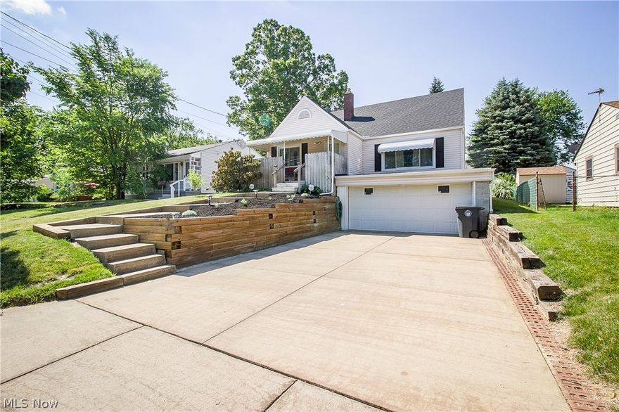 COZY CAPE COD LOCATED JUST MINUTES FROM GOODYEAR METRO PARK!  This Goodyear Heights home has been nicely updated and ready for a new owner.  The welcoming wrap around porch leads into the living room with original hardwood floors, large picture window, and ceiling fan.  The bright and clean kitchen has laminate flooring, Corian counters, tons of cabinetry including a pantry plus space for a small dining table.  Two bedrooms, each with refinished hardwood flooring share the updated full bath with ceramic tile floor, newer vanity, and walk-in shower.  Upstairs, you'll find a huge bedroom with two closets and lots of storage space.  The lower level is partially finished adding a rec room, kitchenette, laundry room and full bath with walk-in shower.  You'll love the private backyard with patio and water feature plus a 10 x 14 shed for all your lawn equipment.  Plenty of room for parking in the wide drive that leads to the attached garage!   Updates include windows 2007, roof, awnings, wate