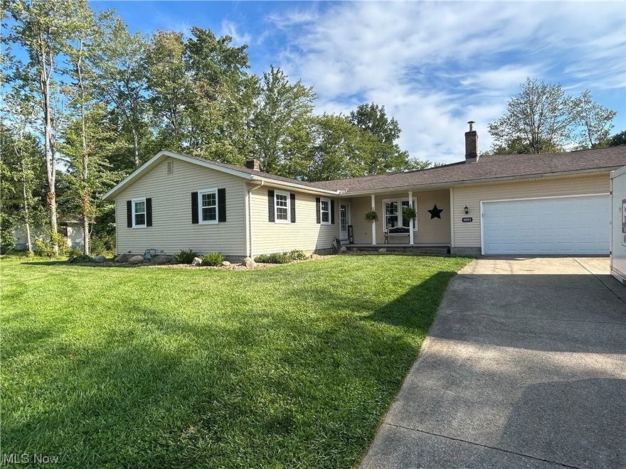 Entertain with ease inside and out with this stunning 2300 sq ft on main level 4 bedroom, 3 full nicely-tiled bath ranch with handy walkout basement on 1.5 acres.  The beautifully updated kitchen has lots of custom  Amish cabinetry and counter space offering stainless steel appliances.  Very open floor plan, fresh neutral decor, two separate master bedrooms w/own full baths on opposite sides of the home for added privacy. Vaulted ceilings in all the right places.  More features include a full-brick wood burning fireplace sided with built-in shelves, sky light, bay window, walk-in closets and nice foyer entry.  The new quality vinyl-plank flooring flows through foyer, hallway, kitchen and dining room makes cleaning easy. Most windows replaced in 2022.  Two car attached garage has a brand new garage door and concrete floor enters mudroom.  Basement includes great storage, workshop (shelving cabinets bench) 5th bedroom option, pet shower station, concreted crawlspace, glass block windows, 200 amp elec box, 2 furnaces, and 2 central air units for efficient home comfort.  Two separate sitting areas on wrap around deck from master to family room. Lots of extra parking, easy-care landscaping, wooded back view located across from Trophy Club allotment has close access to 71 and turnpike.  A calming creek with walk-over bridge near property edge; large shed w/electric at the rear.  An exceptionally clean home; unpack and simply enjoy life in this unique home.