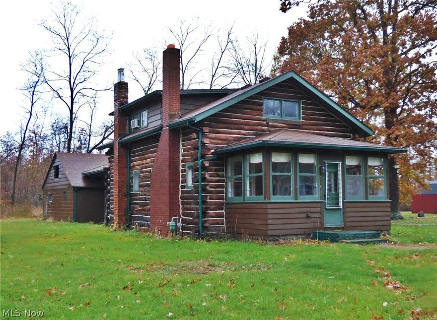 Cute 100 Year Old Log Cabin with 3 bedrooms and 1.5 bathrooms. Enjoy relaxing by the fire in the spacious living room featuring wood burning fireplace. Master bedroom on 2nd floor has attached half bath, other features of this home include 1st floor laundry, heated front porch, double lot, 2 car attached garage, newer furnace and more.