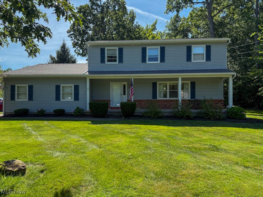 Beautifully refreshed 4-bed, 2-bath colonial in a quiet, well-kept neighborhood. Step inside to fresh paint and brand-new carpet throughout. The spacious eat-in kitchen flows into a formal dining room and a cozy living room, perfect for gatherings. The family room features a fireplace and opens to a screened-in porch for added living space. Relax on the charming front porch or take advantage of the 2-car garage and generous layout. A perfect blend of comfort and functionality.