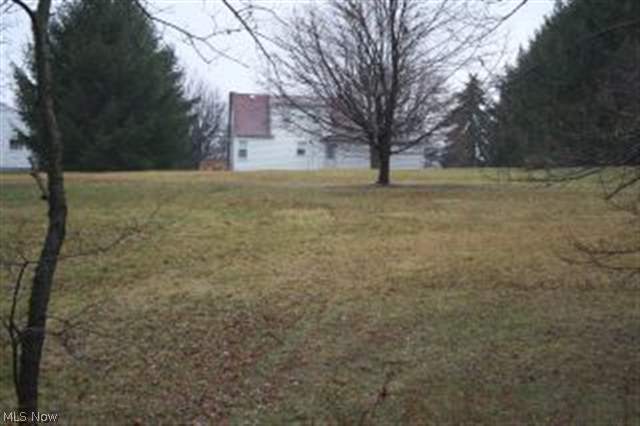 Lot will be surveyed from back 1/2 of current 0.93 acre lot of home at 239 S. Marietta St. Beautiful lot, city utilities near by.
